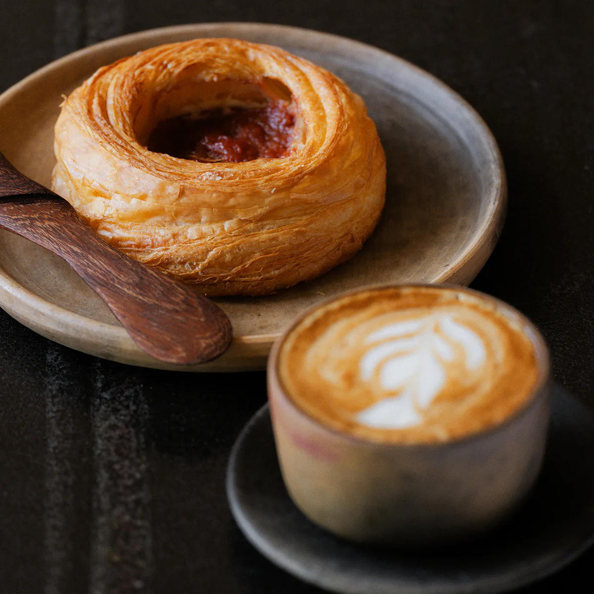 Colima breakfast tray with bread, eggs, and Rosetta Bakery pastries