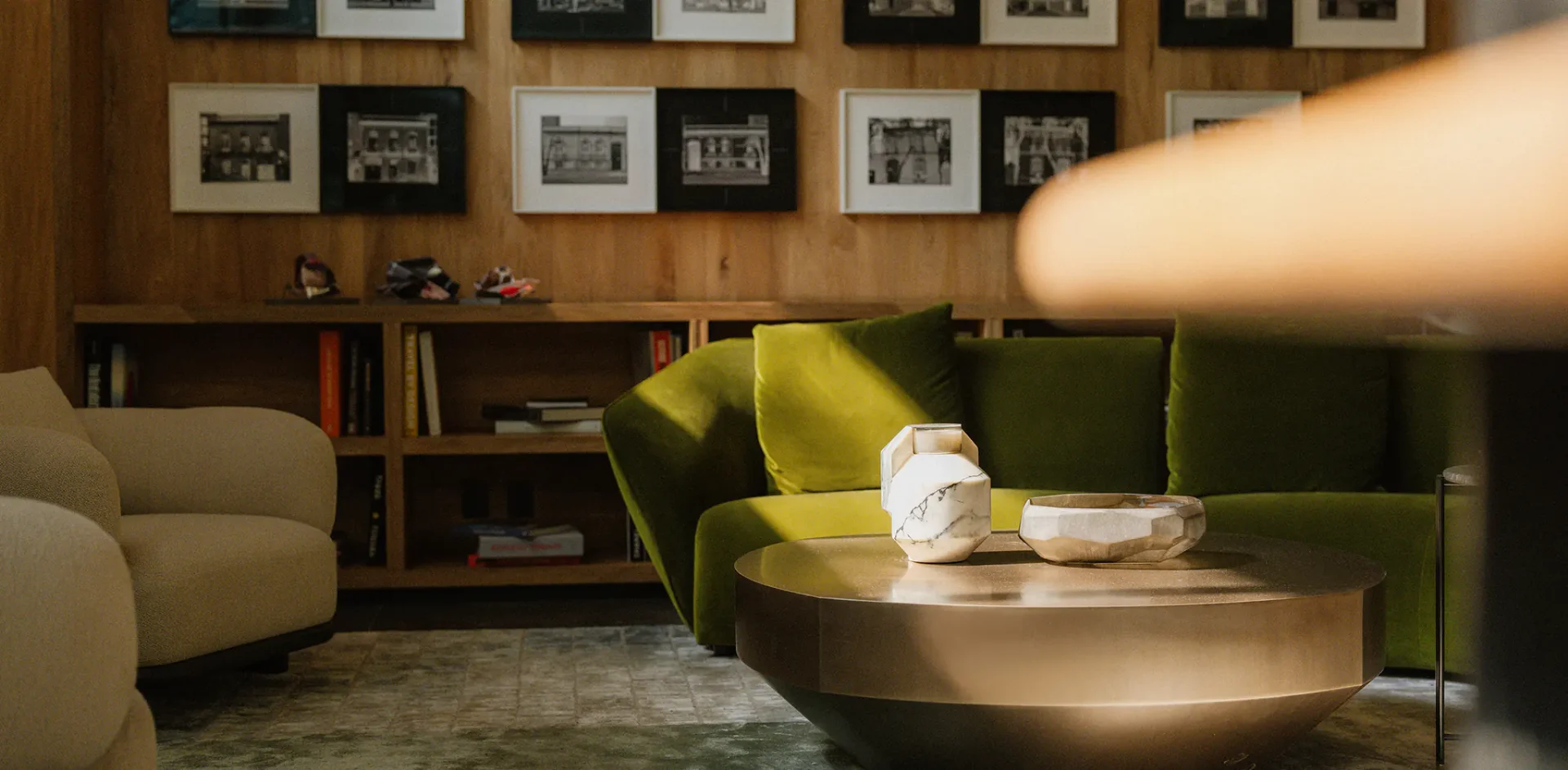 Curated art gallery wall inside Colima 71 lounge