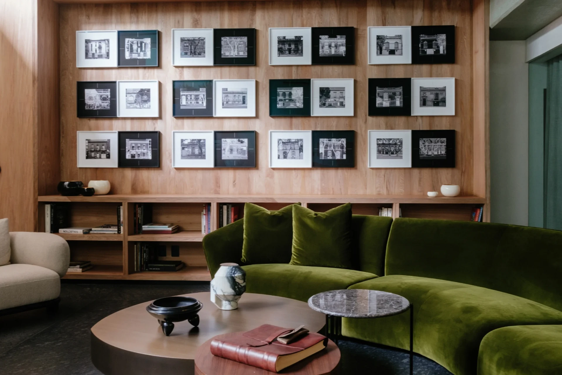 Curated art gallery wall inside Colima 71 lounge